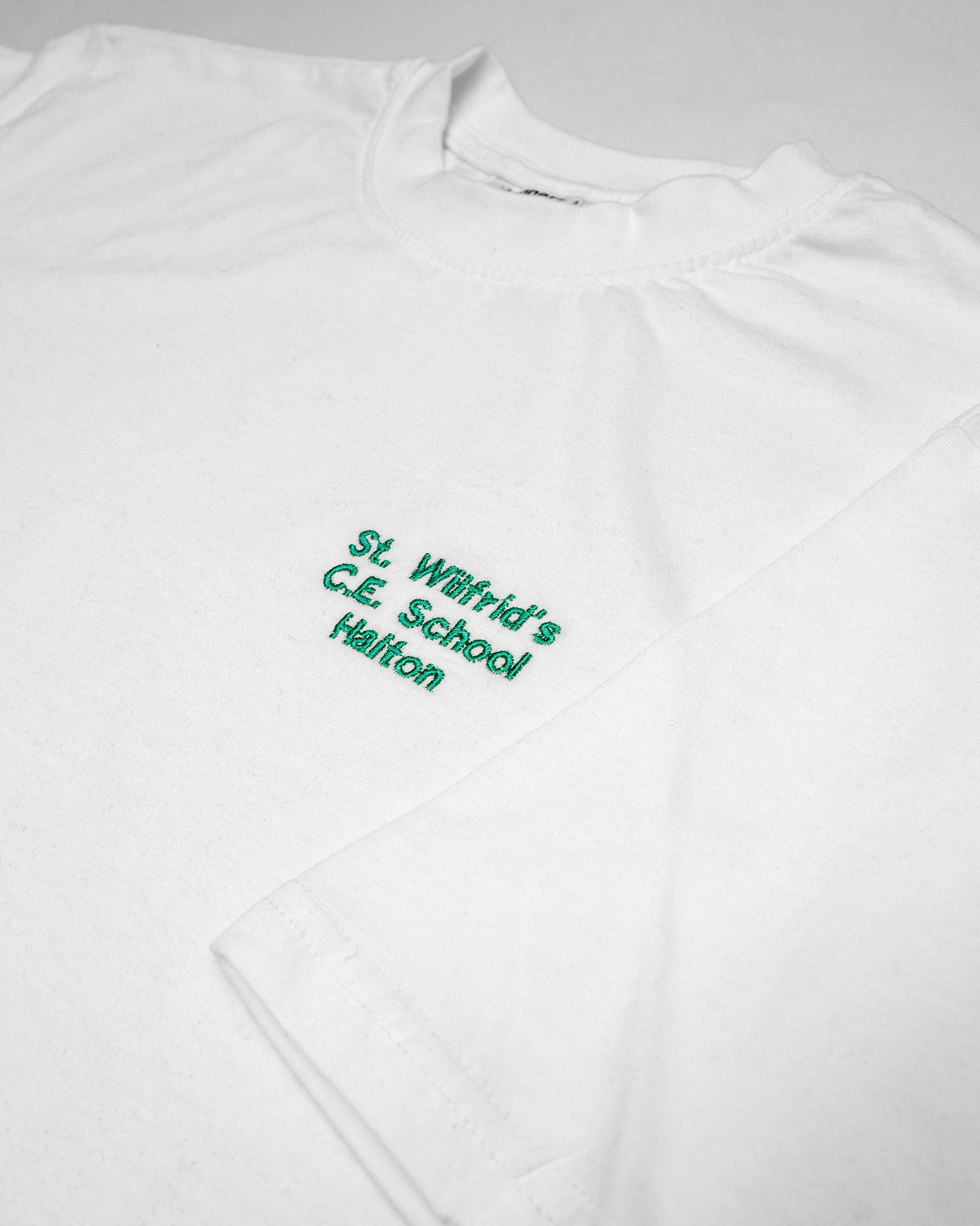 St Wilfrid's Halton P.E Top (WHITE)